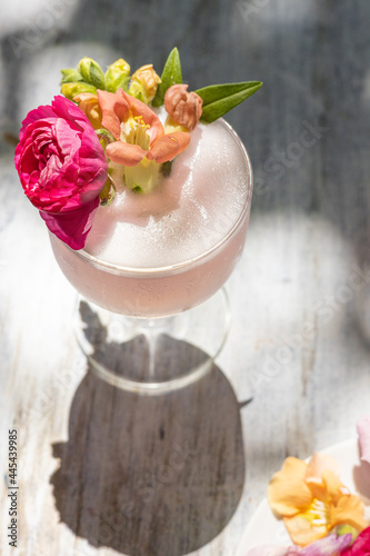 Cocktail with fresh flower garnish 1