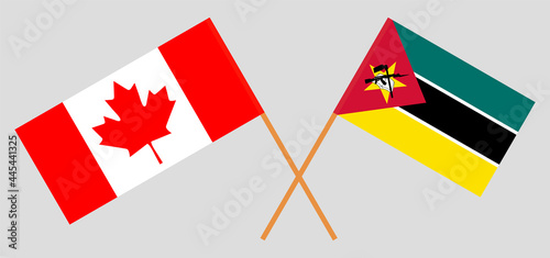 Crossed flags of Canada and Mozambique. Official colors. Correct proportion