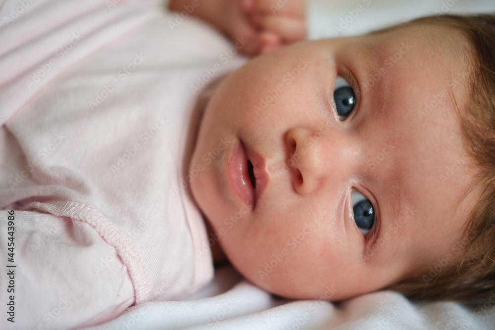 cute little baby girl lying on white plaid. Happy family cute little baby girl lying on white plaid. Happy family