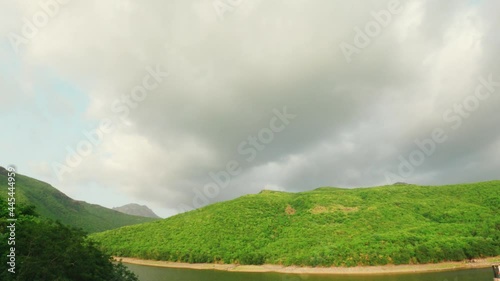 4K Time lapse video of Clouds over green Girnar mountain at Willingdon Dam of Junagadh, Gujarat, India. Beautiful nature during monsoon season photo