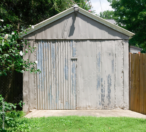 Old fashioned weathered metal garage shed.