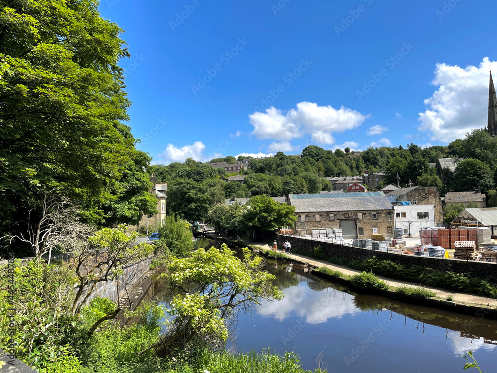 View over the, Rochdale Canal, with buildings and trees, near the centre of, Todmorden, Yorkshire, 