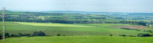 Panorama of meadows, fields and the small town of Rohatyn on a sunny day in summer in Ukraine