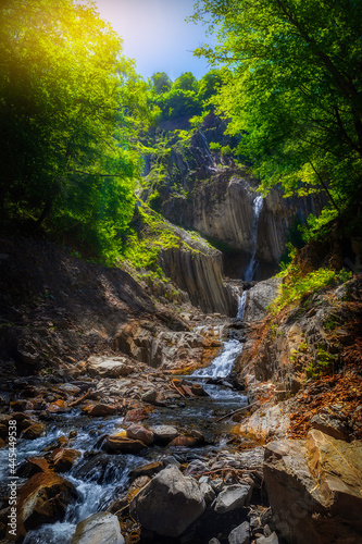 Waterfall in the mountains in summer
