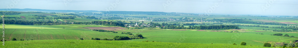 Panorama of meadows, fields and the small town of Rohatyn on a sunny day in summer in Ukraine Panorama of meadows, fields and the small town of Rohatyn on a sunny day in summer in Ukraine
