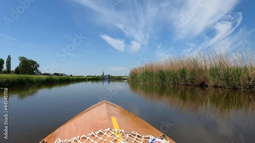 Canoeing on a canal around Westhem Friesland, The Netherlands photo