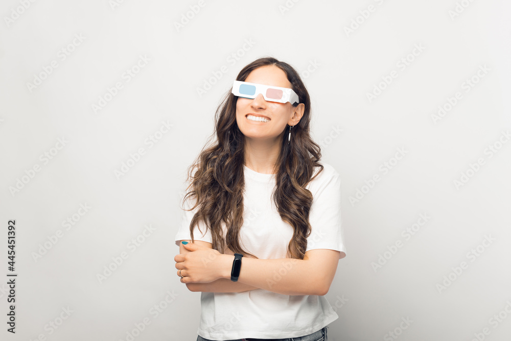 Photo of pretty girl in 3D glasses, isolated on white. The concept of cinema entertainment Photo of pretty girl in 3D glasses, isolated on white. The concept of cinema entertainment