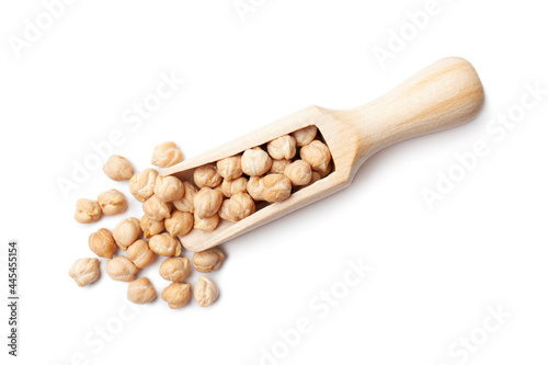 Raw chickpea beans in wooden scoop isolated on white background. Uncooked chickpeas, top view. Healthy eating