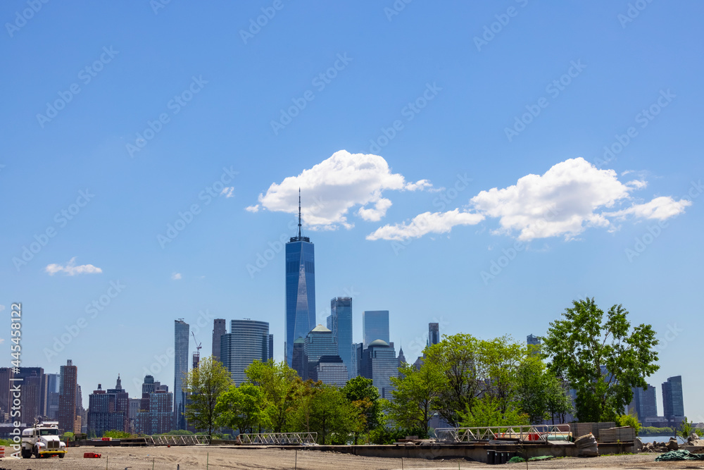 Unique shape clouds float over the Lower Manhattan skyscraper in springtime at New York City NY USA on May 14 2021. Image was taken from Jersey City NJ. Unique shape clouds float over the Lower Manhattan skyscraper in springtime at New York City NY USA on May 14 2021. Image was taken from Jersey City NJ.