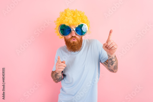 Funny man with peruke and sunglasses dances