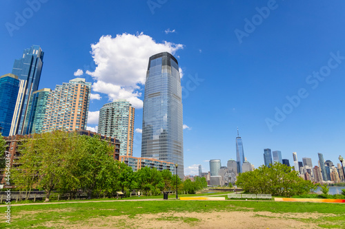 Unique shape clouds float over the Luxury high-rise apartments in Jersey City New Jersey ward and Lower Manhattan skyscraper in Manhattan ward in springtime at New York City NY USA on May 14 2021. 