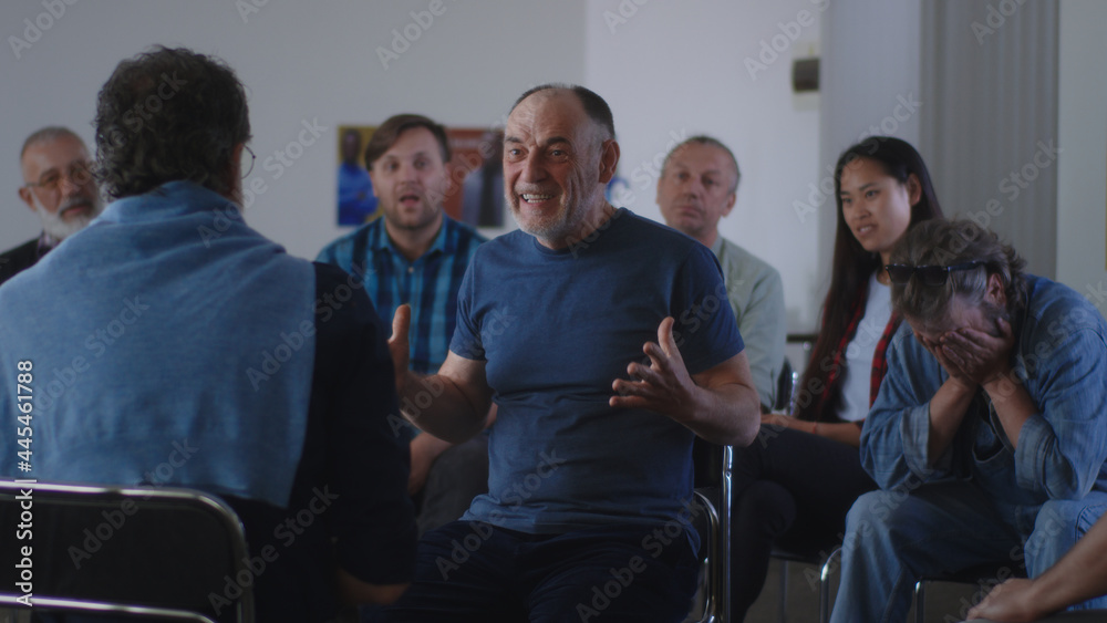Happy Aged man sharing story of successful addiction overcoming Happy Aged man sharing story of successful addiction overcoming
