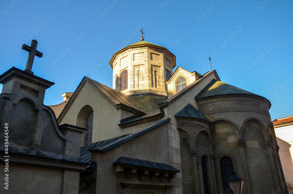 Domes and facade  with christian cross on the tower of Ancient Armenian church of the Assumption of Mary in Lviv, Ukraine
