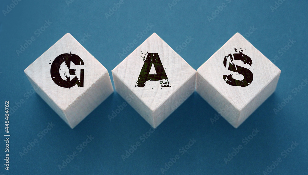 Gas -word on wooden cubes with letters on black. Energy gas oil economy concept Gas -word on wooden cubes with letters on black. Energy gas oil economy concept