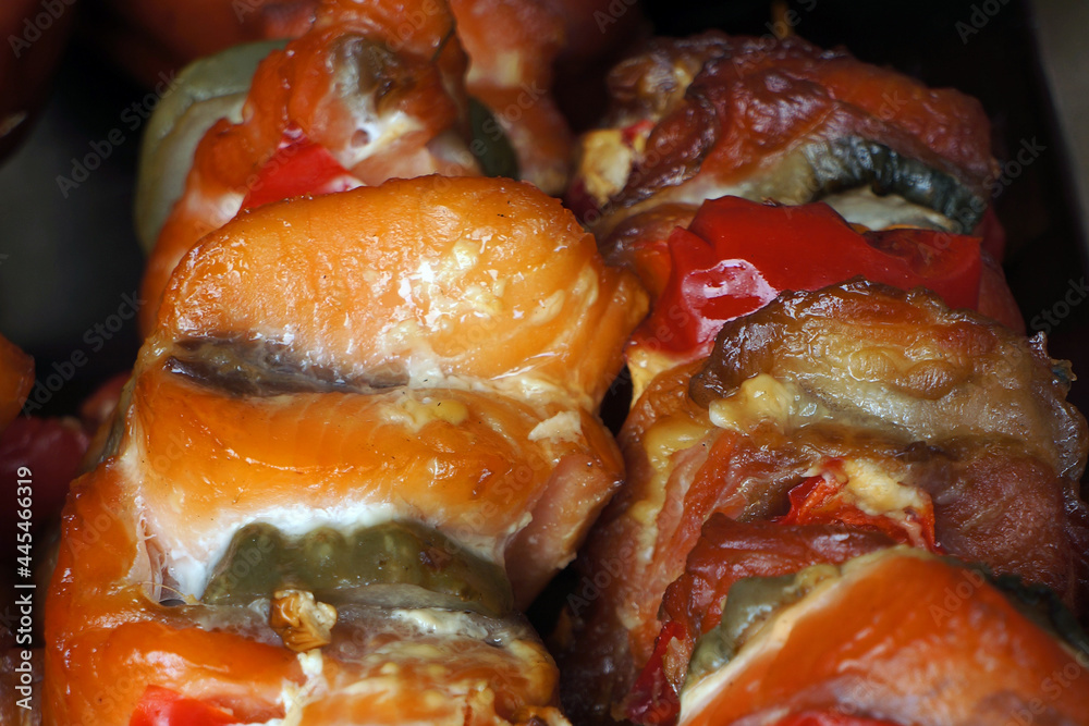 Kebab shashlik of smoked salmon with vegetables on skewers.