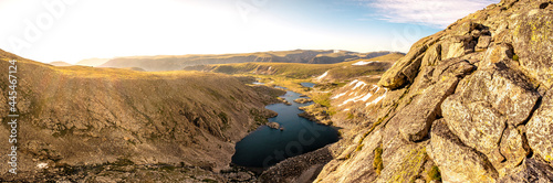 Sunrise over alpine lakes in the mountains panorama photo