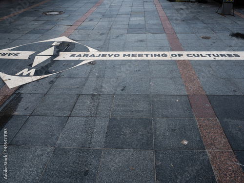 Ground-embedded sign symbolizing a meeting point of diverse cultural and historical periods, that have shaped Sarajevo.
Sarajevo, Bosnia and Herzegovina.
