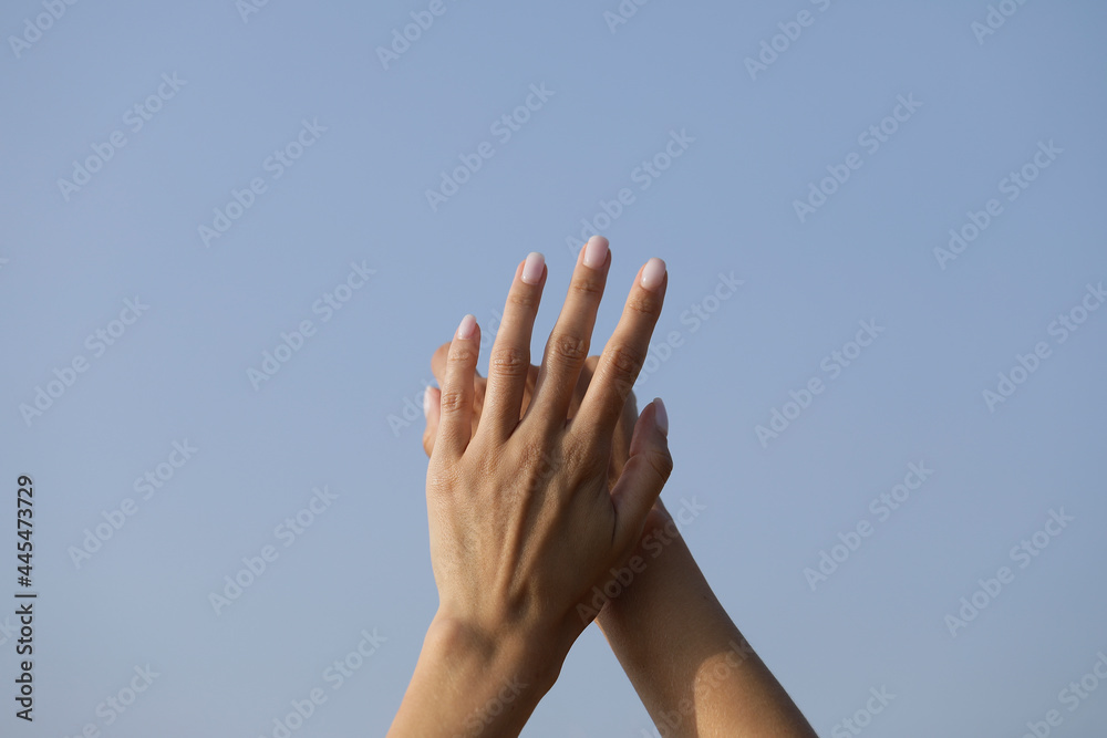 hands on blue sky. Sensual. Sky background. Life. Lifestyle. People. Hope hands on blue sky. Sensual. Sky background. Life. Lifestyle. People. Hope