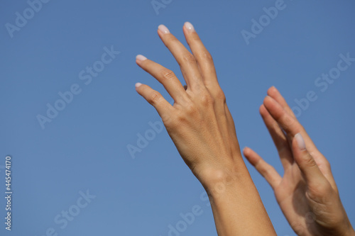 hands reaching for the sky