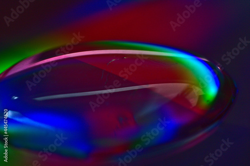close/up of a waterdrop with colorful reflections