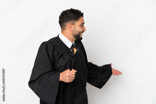 Judge arab man isolated on white background with surprise expression while looking side photo