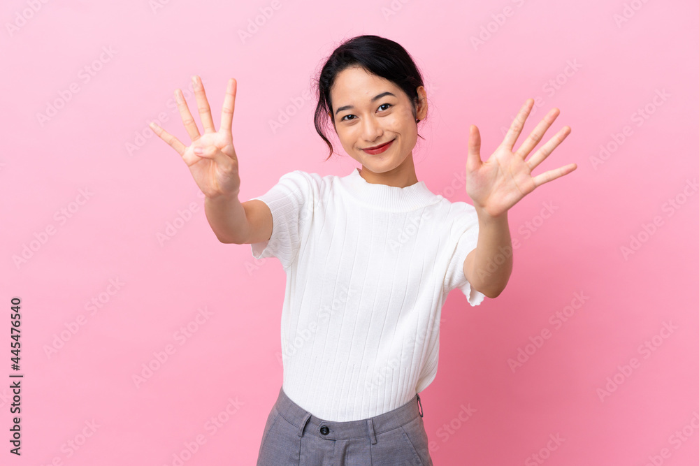 Young Vietnamese woman isolated on pink background counting nine with fingers Young Vietnamese woman isolated on pink background counting nine with fingers