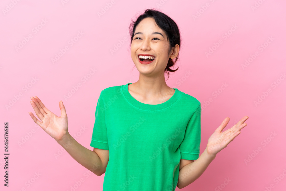 Young Vietnamese woman isolated on pink background smiling a lot Young Vietnamese woman isolated on pink background smiling a lot