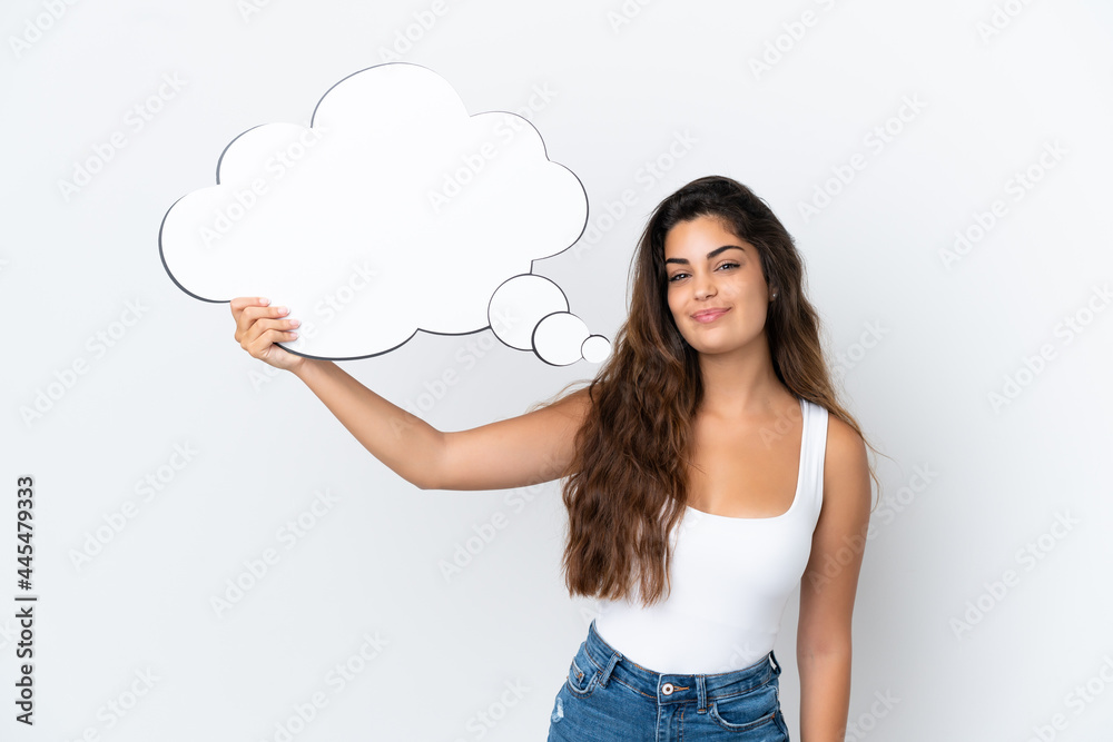Young caucasian woman isolated on white background holding a thinking speech bubble Young caucasian woman isolated on white background holding a thinking speech bubble