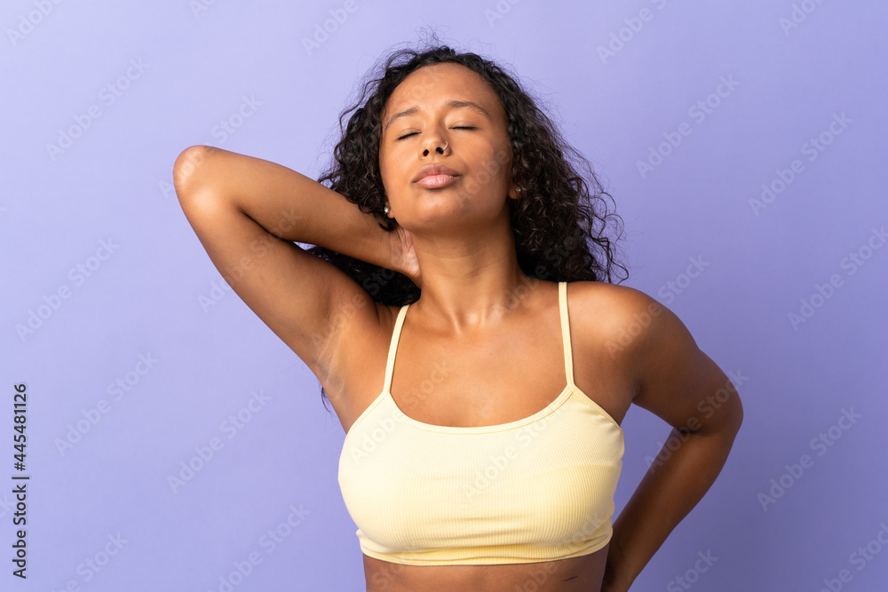 Teenager cuban girl isolated on purple background with neckache Teenager cuban girl isolated on purple background with neckache