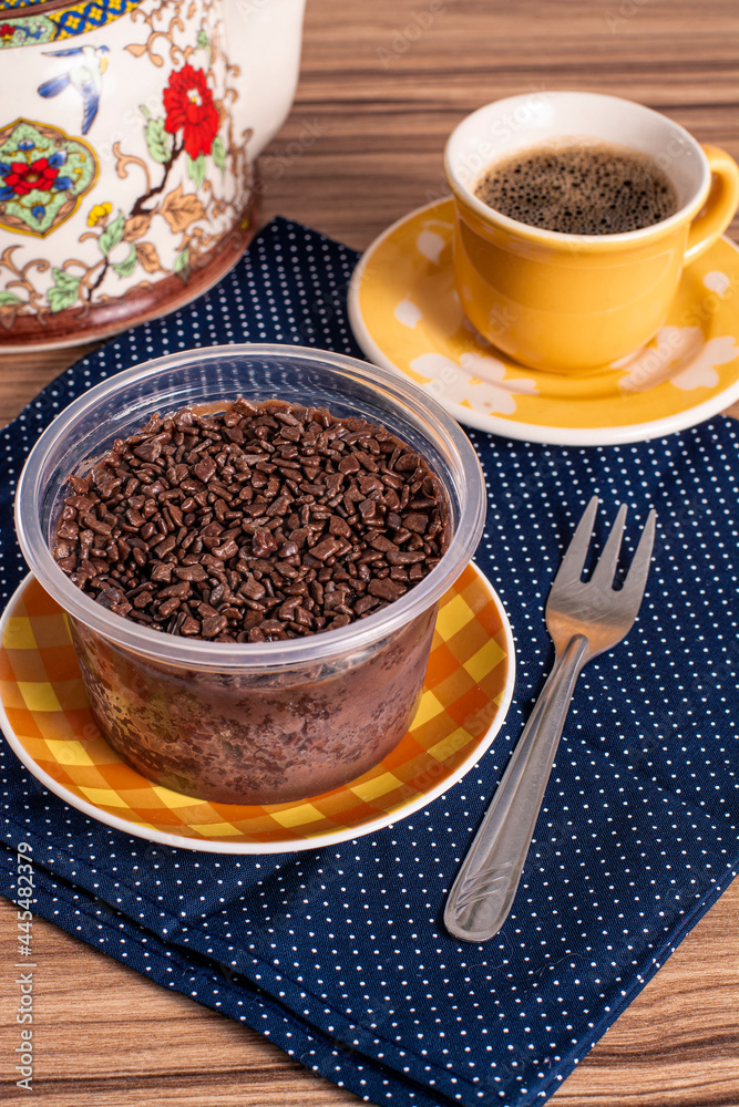 cake in brigadeiro pot on wooden background cake in brigadeiro pot on wooden background