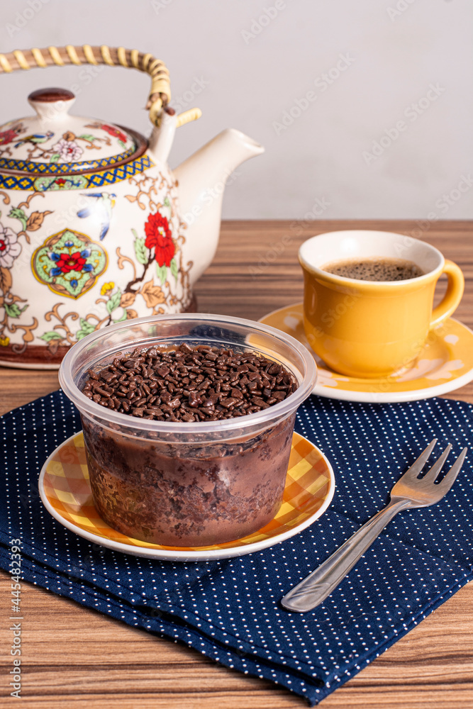 cake in brigadeiro pot on wooden background cake in brigadeiro pot on wooden background