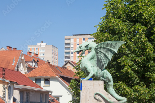 Dragon statue on zmajski most, or zmajev most (Dragon bridge) in Ljubljana, capital city of Slovenia. The dragon is considered to be the symbol of the city, protecting it... photo