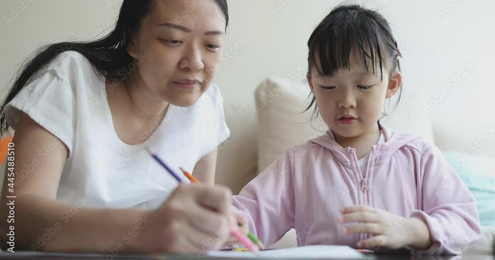 4K Video slow motion Asian mom teach her little daughter draw picture with color pencil. Concept of learning from home and family activity. 4K Video slow motion Asian mom teach her little daughter draw picture with color pencil. Concept of learning from home and family activity.
