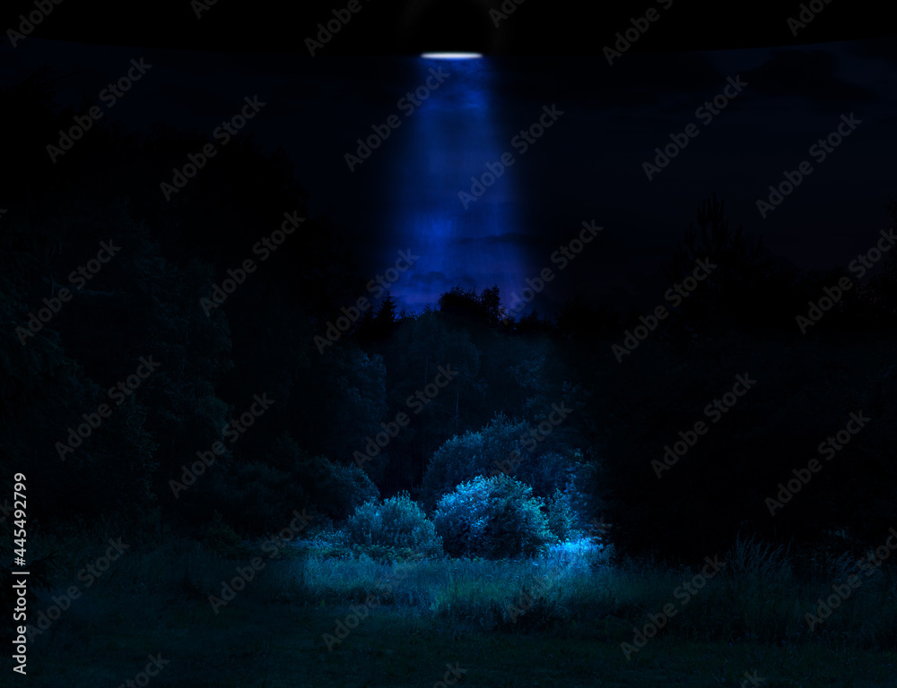 Sci-fi concept illustration. Unknown flying object illuminating forest meadow with blue light during midnight. Color dodge effect. Image contain noise and grain