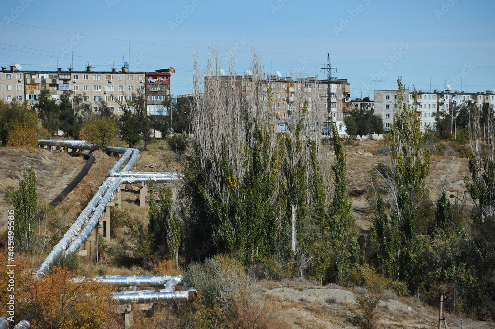 Zhezkazgan, Kazakhtan - 10.10.2016 : The pipes of the heating plant passing along the residential buildings of the city