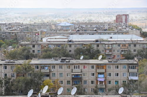 Zhezkazgan, Kazakhtan - 10.10.2016 : Residential buildings, commercial buildings and courtyards along the central streets of the city. photo