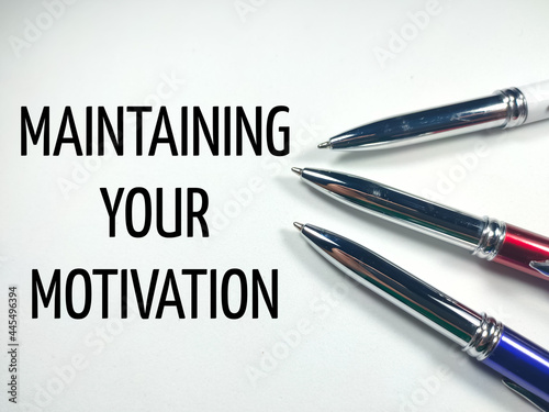 Motivation concept.Text MAINTAINING YOUR MOTIVATION with colorful pen on a white background.