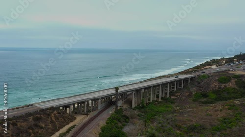 Wallpaper Mural Vehicles Driving On Bridge Over Train Tracks With Seascape In Del Mar, San Diego, California, USA. - aerial Torontodigital.ca