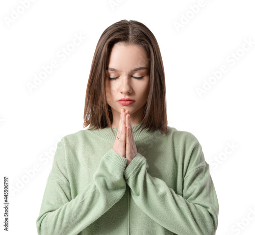 Religious young woman prayi...