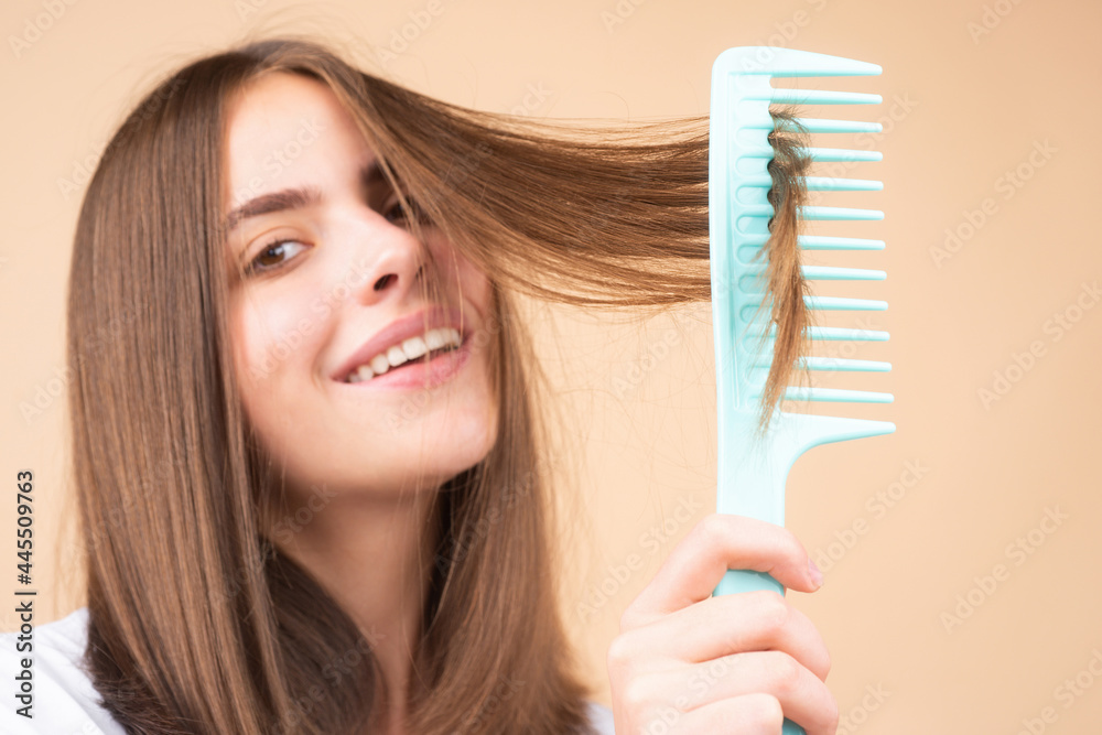 Woman brushing straight natural hair with comb. Girl combing long healthy hair with hairbrush. Hair care beauty concept. Brushing Hair. Woman brushing straight natural hair with comb. Girl combing long healthy hair with hairbrush. Hair care beauty concept. Brushing Hair.