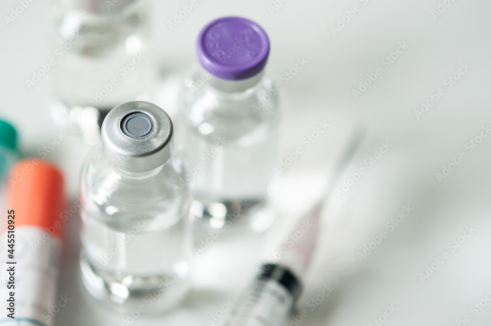 Selective Focus of Syringe and Medicine in vial , ready for vaccine injection , Cancer Treatment , Pain Treatment and can also be abused for an illegal use, healthcare and medical concept vaccination. Selective Focus of Syringe and Medicine in vial , ready for vaccine injection , Cancer Treatment , Pain Treatment and can also be abused for an illegal use, healthcare and medical concept vaccination.