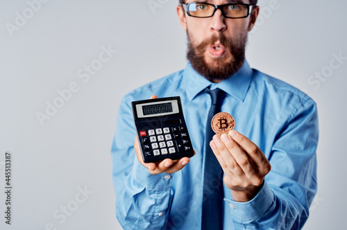 business man with calculator cryptocurrency bitcoin investment