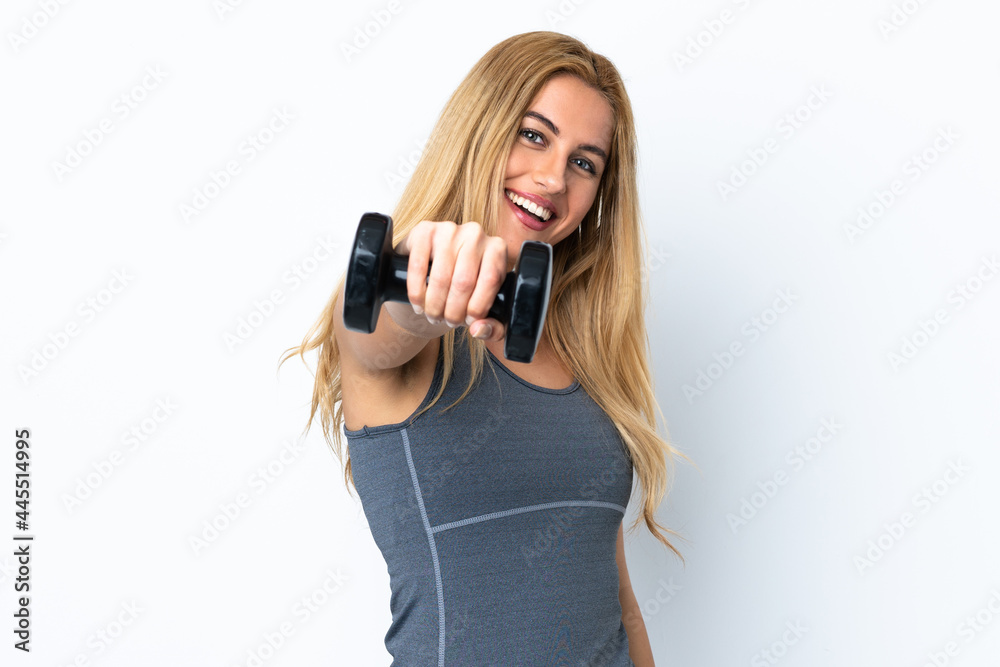 Young blonde sport woman making weightlifting over isolated purple background Young blonde sport woman making weightlifting over isolated purple background