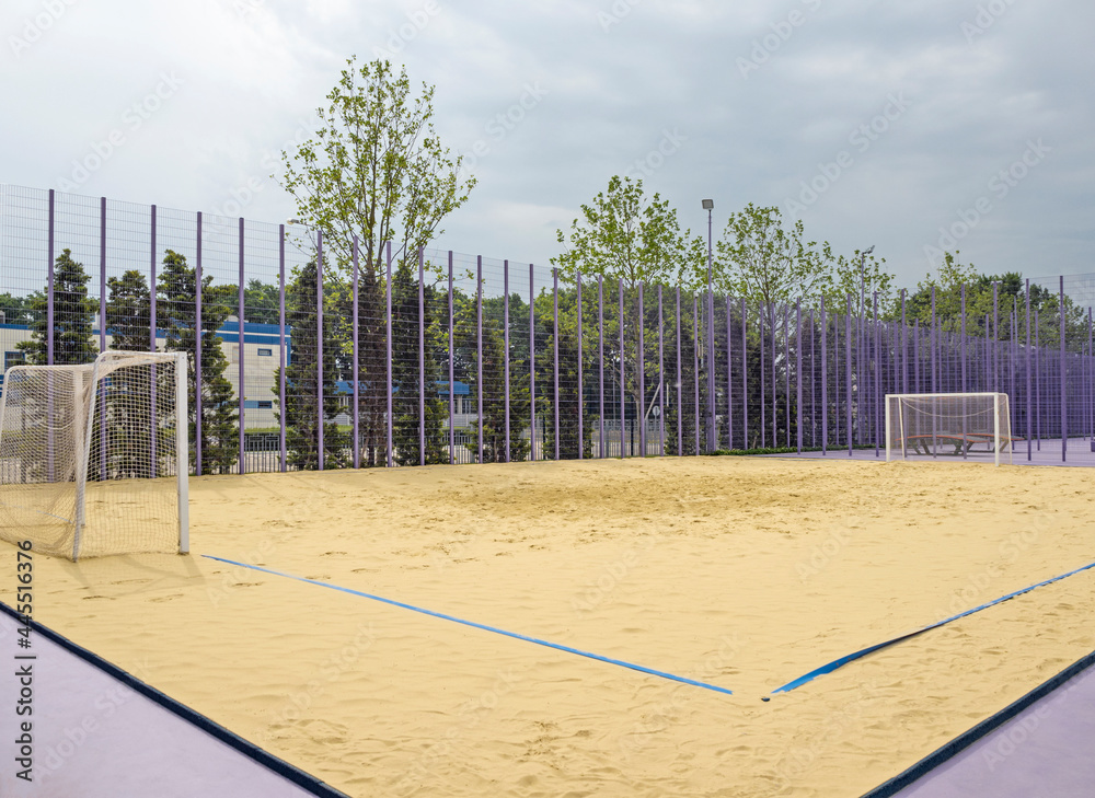 Playing field with sand and goalposts for beach soccer
