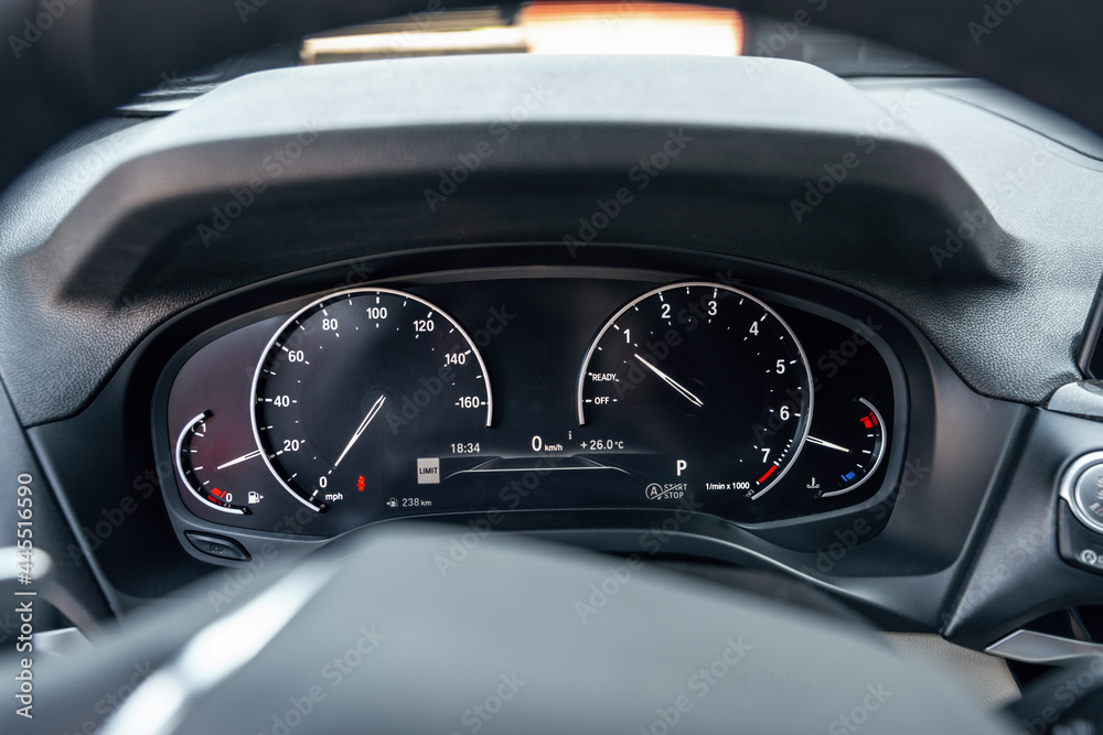 Closeup photo of car interiors. Modern car speedometer.