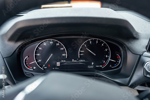 Closeup photo of car interiors. Modern car speedometer.