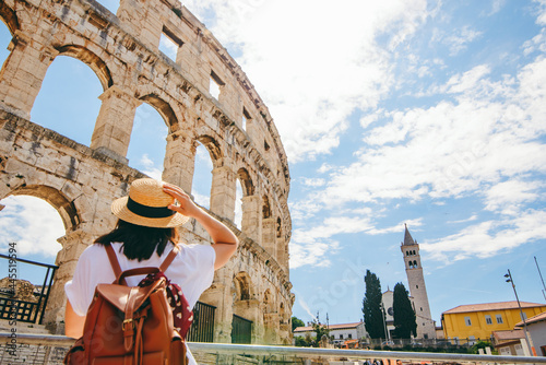 woman looking at coliseum in Pula, Croatia