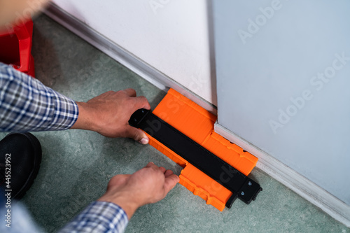 Handyman Using Contour Gauge Tool
