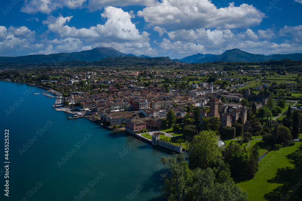 Aerial view of the Scaliger Castle of Lazise. Lazise Lake Garda Italy. Panorama of the historic town of Lazise. Top view of the historic part of the city Lazise Castle on the coastline of Lake Garda