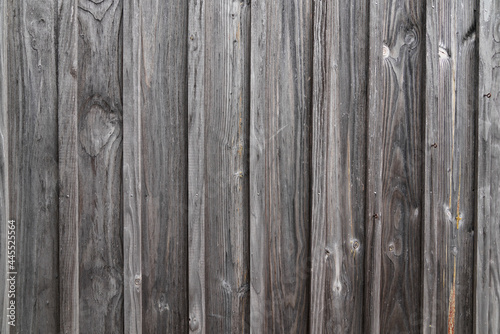 Natural dark used old planks wooden texture background in wood wall